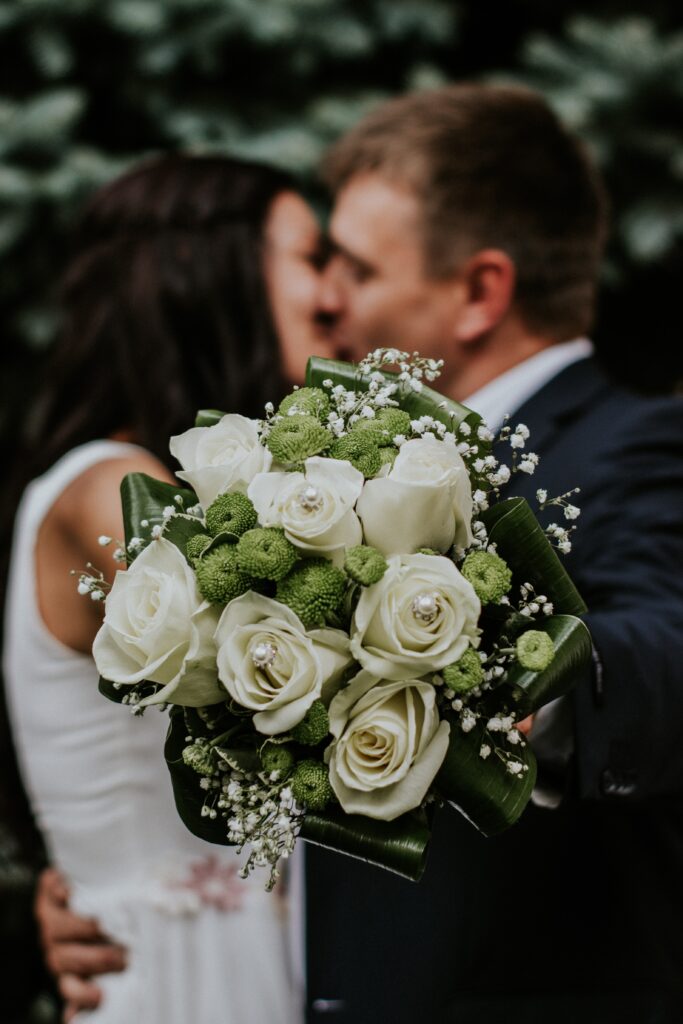Wedding Bouquet and couple kissing in Houston Texas